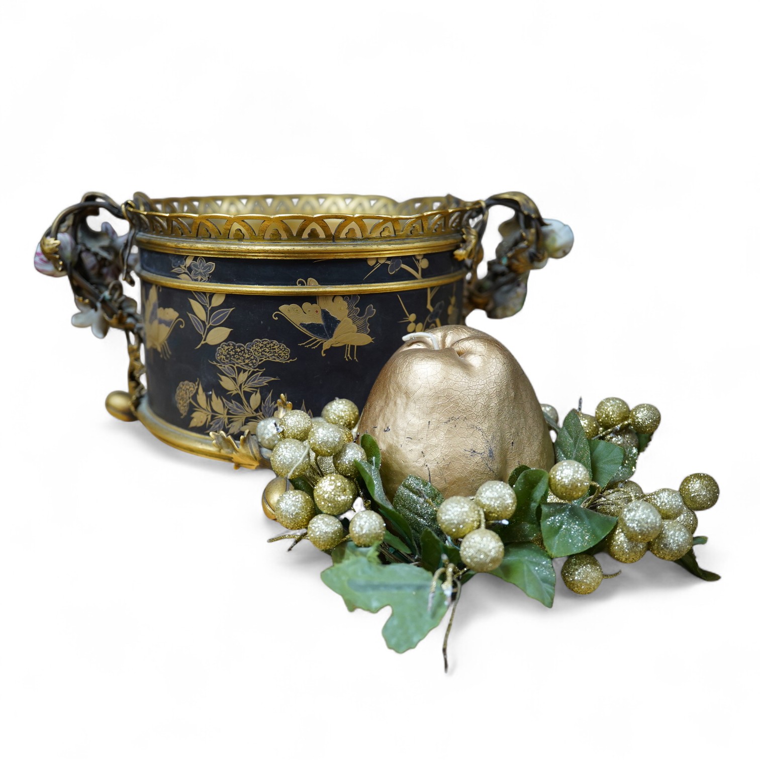 A French ormolu and lacquered jardiniere with porcelain mounted handles, stamped 'Bointaburet A Paris', together with a ‘pear’ candle display. Jardiniere width 23cm. Condition - one handle damaged, interior rubbed